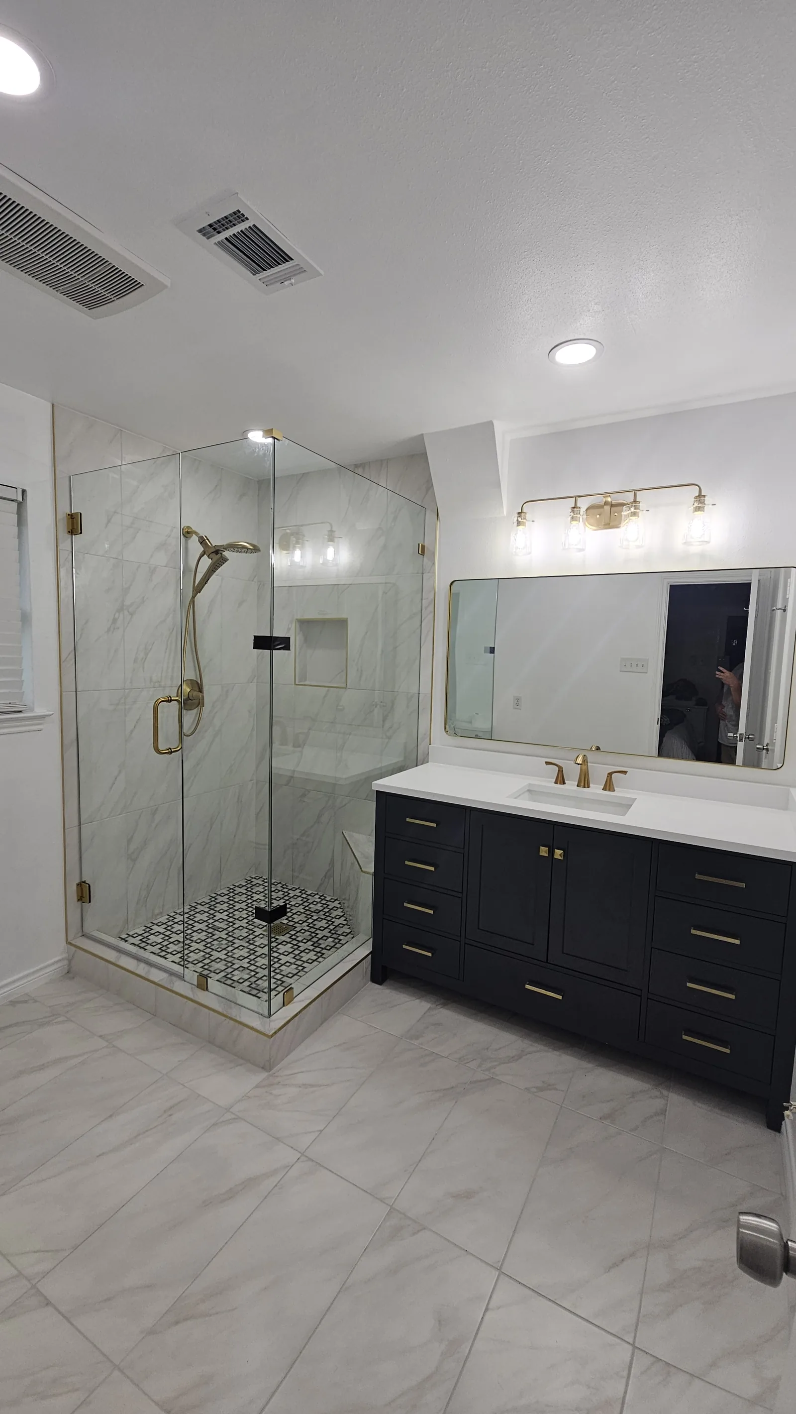 Modern marble and gold bathroom after remodel